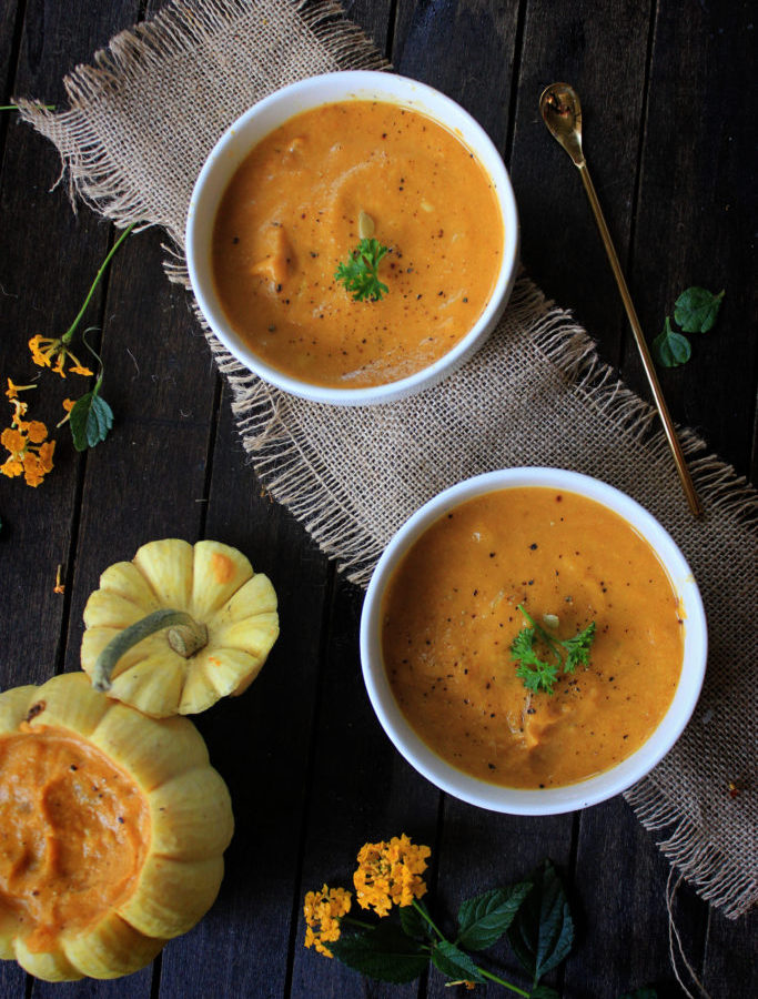 7-Ingredient Pumpkin Soup on a Dark Wooden Board